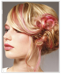 Updo with pink streaks of hair color